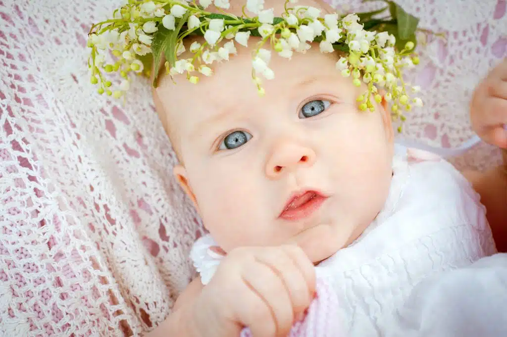 cute baby and flower lily of the valley 2024 07 10 04 49 56 utc 1 Forsiden